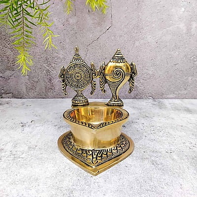Brass Shankh Chakra Diya - 5.5 inch Height | Auspicious Brass Shankh Chakra Diya for Pooja - Shop Now Brass Shankh Chakra Diya - 5.5 inch Height | Auspicious Brass Shankh Chakra Diya for Pooja - Shop Now