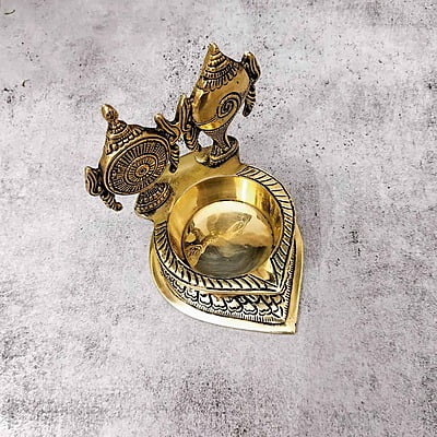 Brass Shankh Chakra Diya - 5.5 inch Height | Auspicious Brass Shankh Chakra Diya for Pooja - Shop Now Brass Shankh Chakra Diya - 5.5 inch Height | Auspicious Brass Shankh Chakra Diya for Pooja - Shop Now
