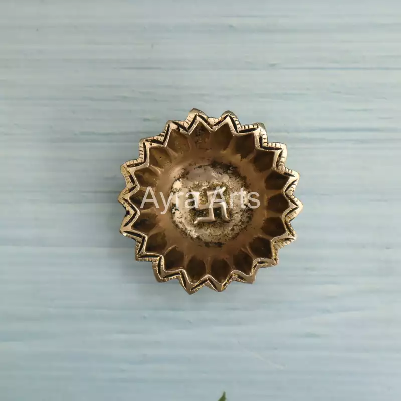 Brass Sun Design Swastik Diya - 1 Inch Height Brass Sun Design Swastik Diya - 1 Inch Height