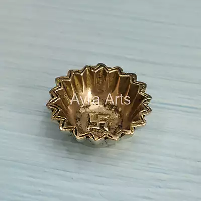 Brass Sun Design Swastik Diya - 1 Inch Height Brass Sun Design Swastik Diya - 1 Inch Height