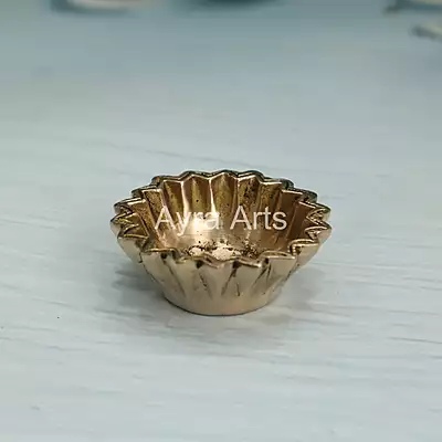 Brass Sun Design Swastik Diya - 1 Inch Height Brass Sun Design Swastik Diya - 1 Inch Height