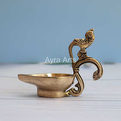 Brass Ek Aarti Handcrafted Aarti Diya with Parrot handle - 4.5 Inch Length Brass Ek Aarti Handcrafted Aarti Diya with Parrot handle - 4.5 Inch Length