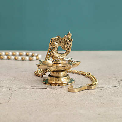 Brass Hanging Peacock Diya Lamp for Puja 7 Oil Wick with Chain for Home Decoration - 3 Inch Length Brass Hanging Peacock Diya Lamp for Puja 7 Oil Wick with Chain for Home Decoration - 3 Inch Length