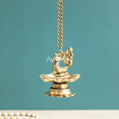 Brass Hanging Peacock Diya Lamp for Puja 7 Oil Wick with Chain for Home Decoration - 3 Inch Length Brass Hanging Peacock Diya Lamp for Puja 7 Oil Wick with Chain for Home Decoration - 3 Inch Length